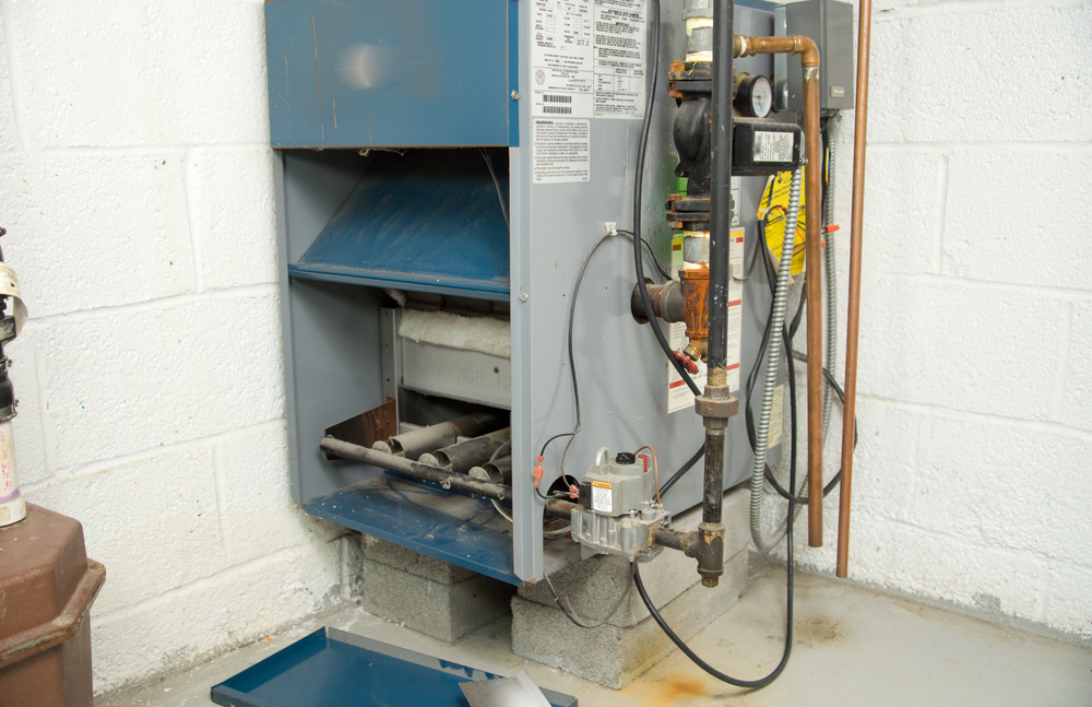 Kelowna Heating - A1 Choice - Furnace needing service in a home